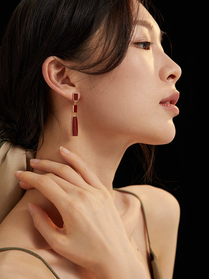 Chinese red uranium drip earrings